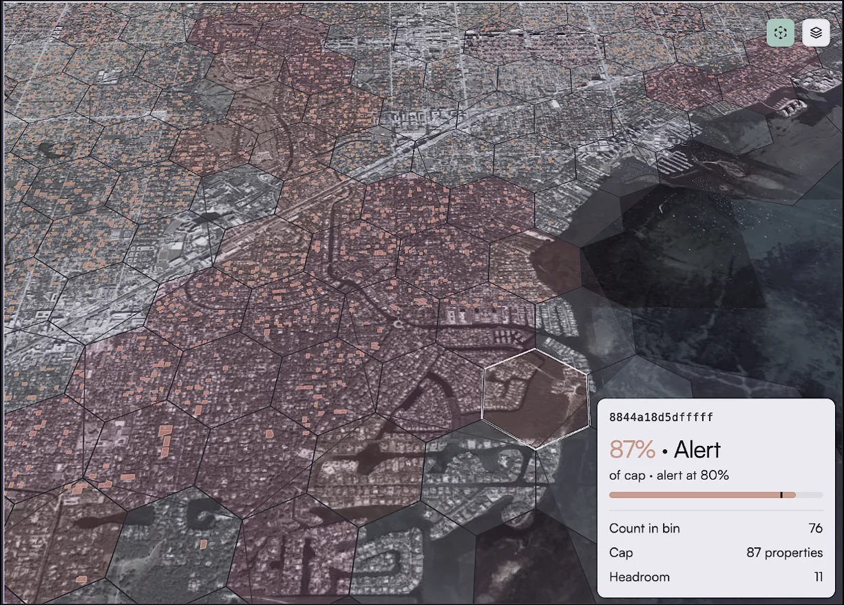 Prometheus exposure view: satellite map with hexagonal risk aggregation and an 87% of cap alert for one area